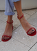 Close up of @carlanunez_ in our Aria red jelly sandals. Front view
