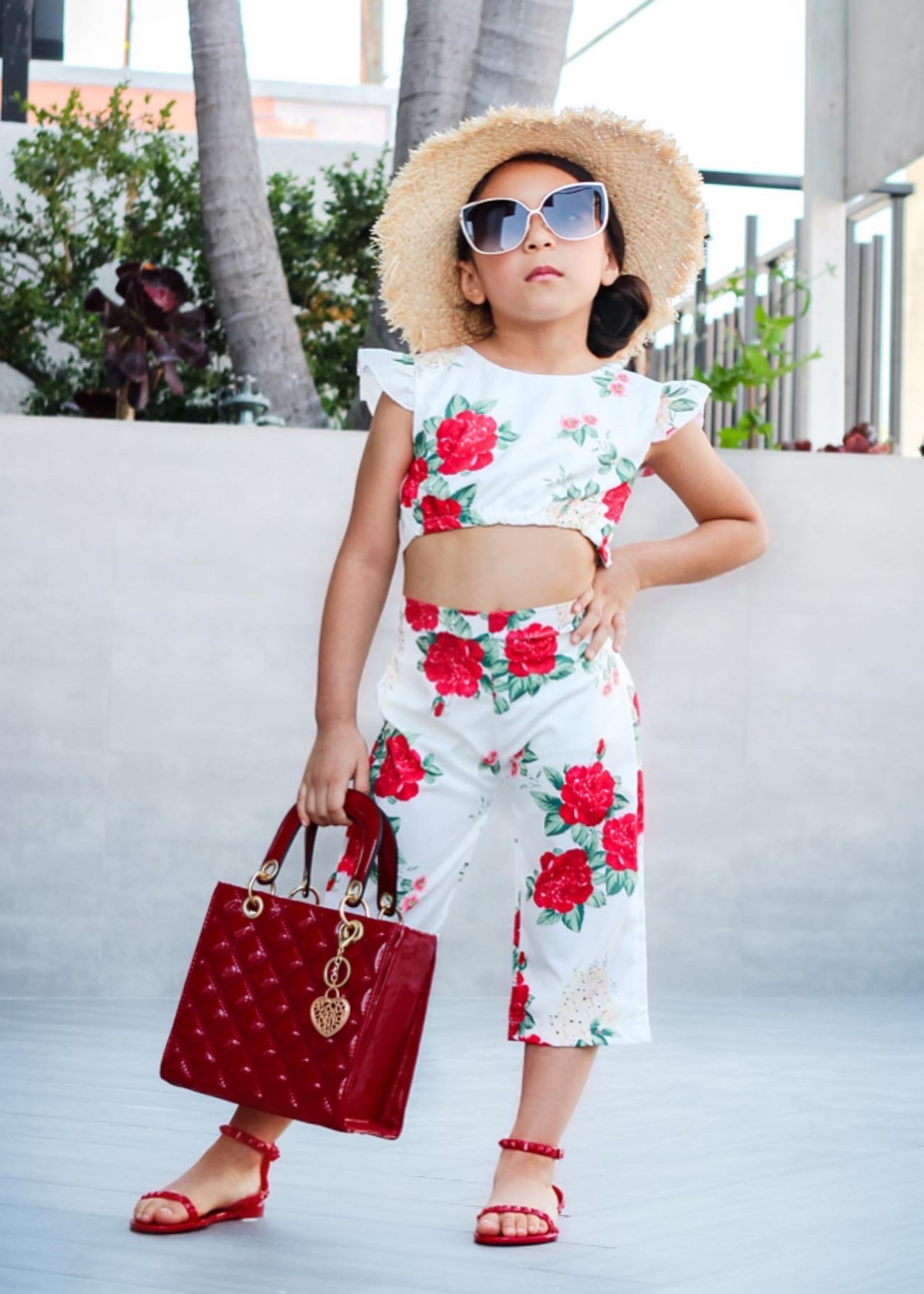 @gracesfunhouse in her weekend two piece flower set accessorized with our kids scarlet jelly sandals.