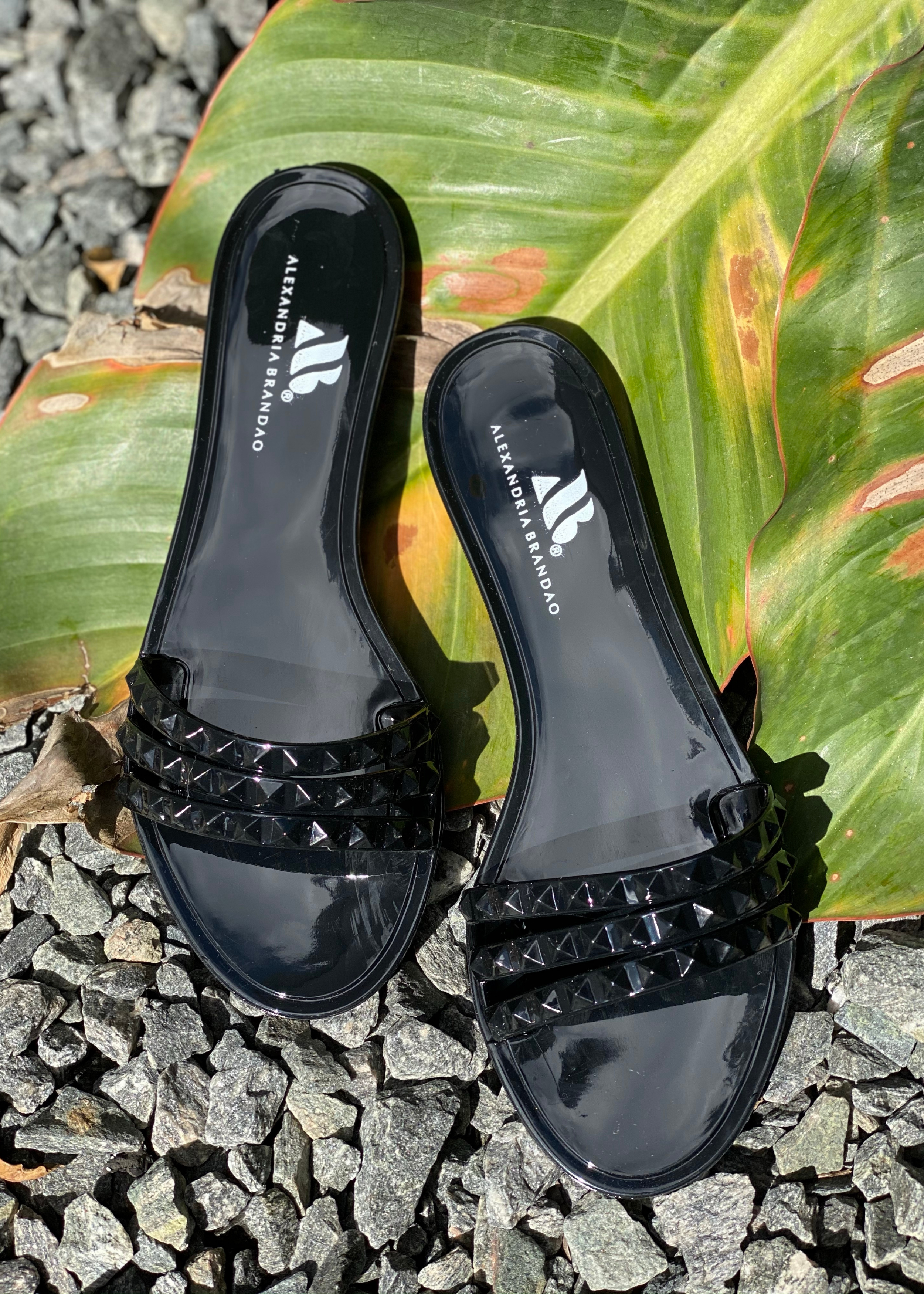 Women's black slides sandals that are waterproof and jelly flip flops for the beach or pool or everyday slides you can use anywhere.
