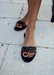 The Women's black waterproof jelly slides sandals with black  jelly soles that can be worn for everyday use or beach sandals or to travel the world sandals by Alexandria Brandao Shoes.