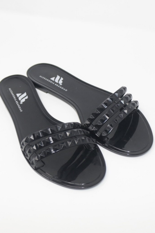 Aria B black jelly slide sandal with three studded straps across the toes.  Edit alt text