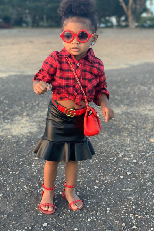 Toddler girl wearing red mommy and me sandals with black leather fall skirt basic