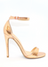 ALI heel in rose gold that is pictured from above and picturing side view and marble top as the background for better view. Ali Heels in rose gold that has a buckle on the ankle and cover heel in the back as well as thick to thin and thick again for secure and comfort.
