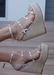 Astrid Espadrille Wedges in Silver that has a espadrille wedge and multi strap gold studded wedge. 