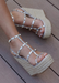 Astrid Espadrille Wedges in Silver that has a espadrille wedge and multi strap gold studded wedge. 