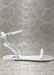 Aria in White jelluy sandals. Side view