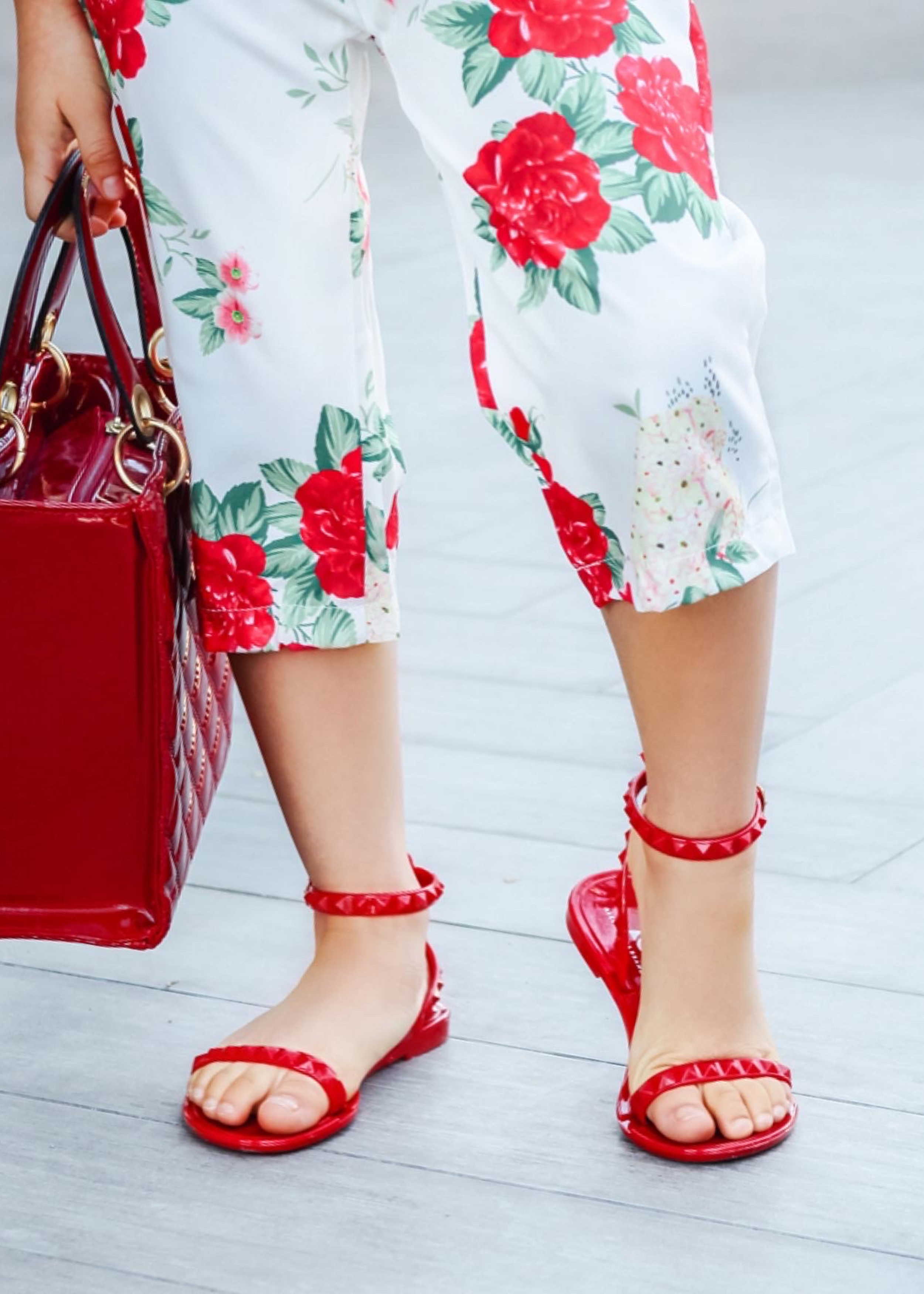 Close up of @gracesfunhouse in our water proof scarlet jelly sandals.