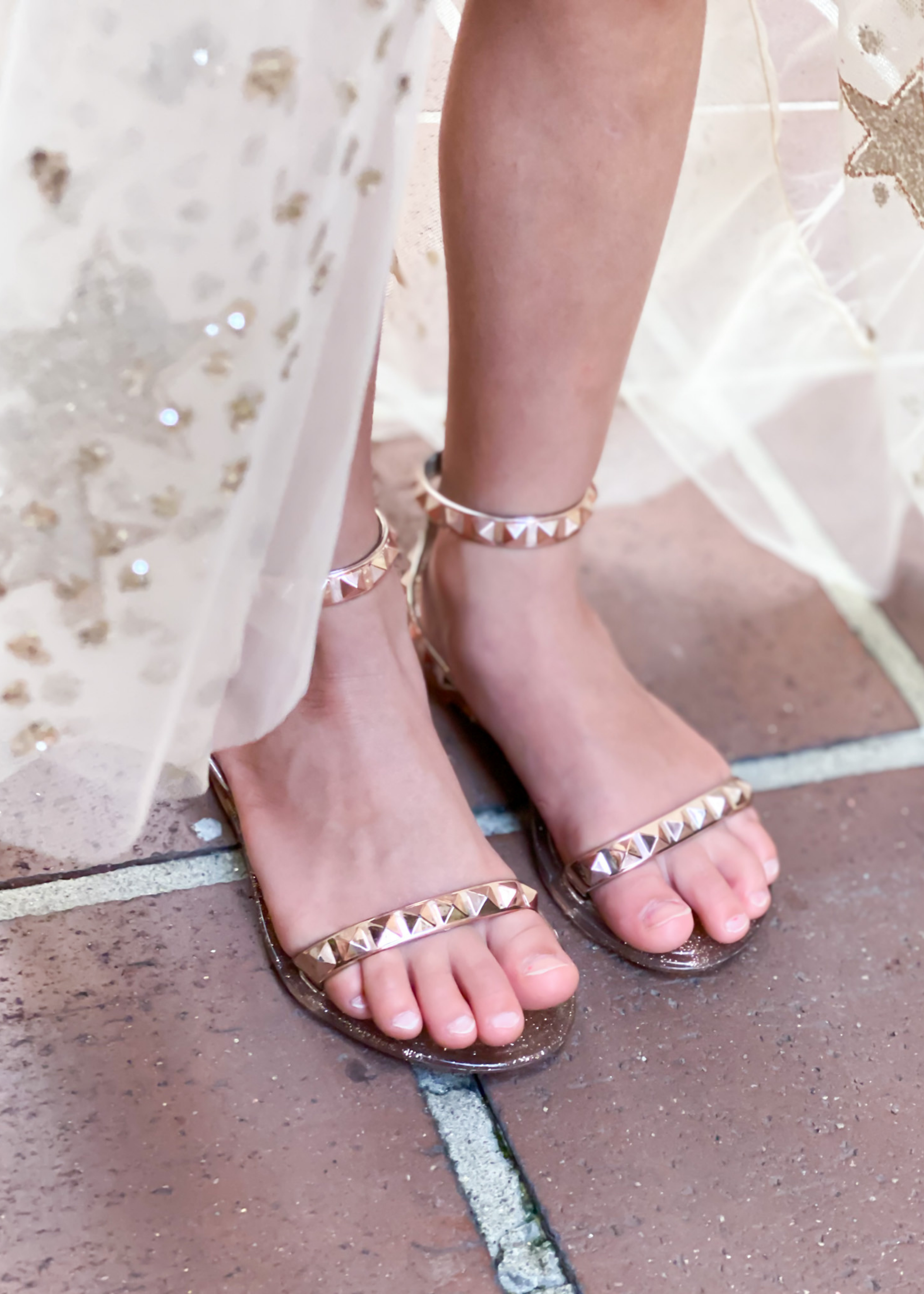 Close up of our Aria kids rose gold water proof jelly sandals on @river_n_rain