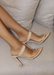 Audrey Heels with Clear Strap in Nude. Audrey Heels with Clear Strap in front where the feet are and nude strap  on the bridge of foot. Has a point sole and you slip it on and off.  The back is always showing and free.