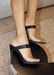 Audrey Heels with Clear Strap in front where the feet are and Black strap  on the bridge of foot. Has a point sole and you slip it on and off.  The back is always showing and free. Side view