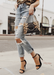 @jamialix wearing Ali heels in Black with ripped light acid washed jeans and a cheetah bag.